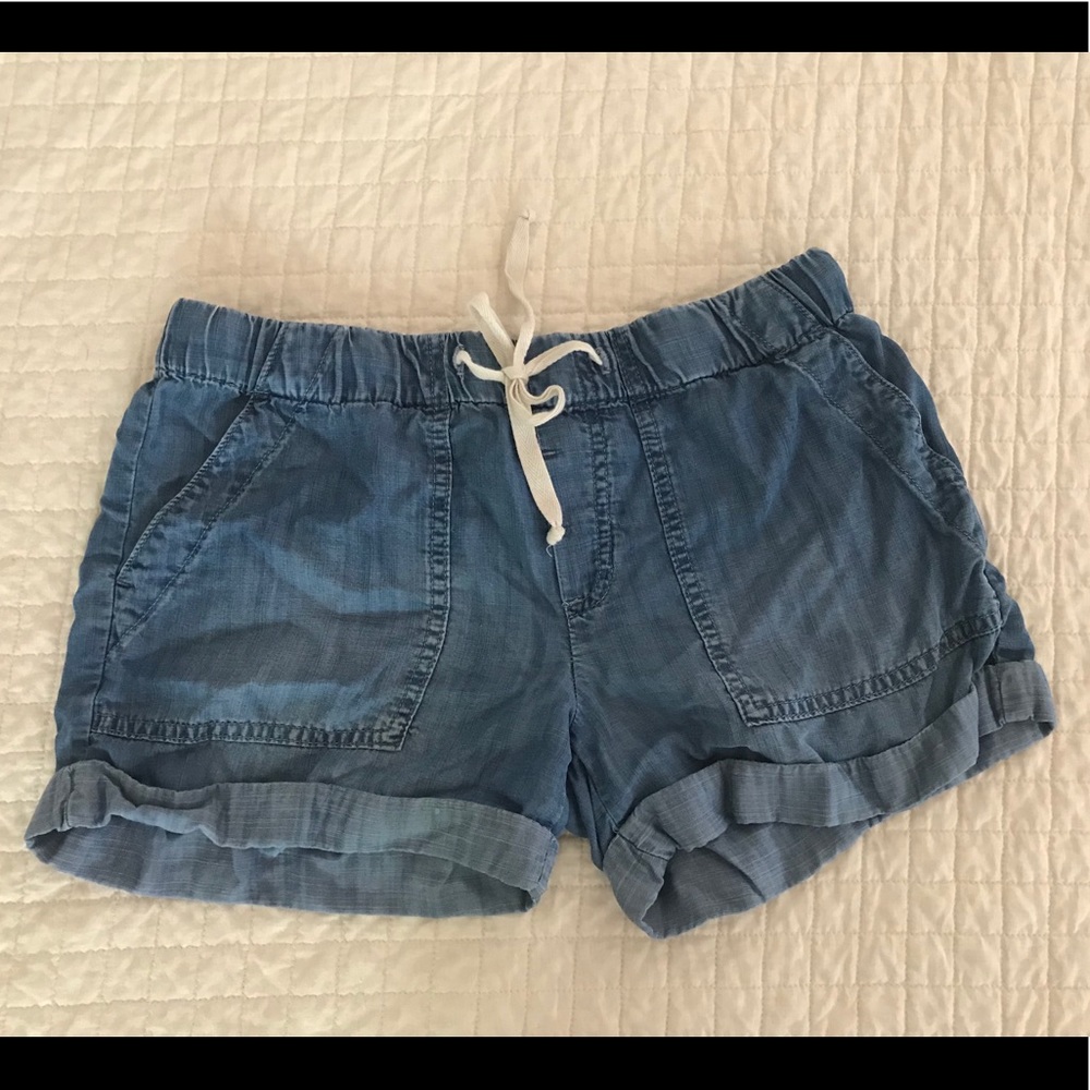 Chelsea and Violet pull on shorts